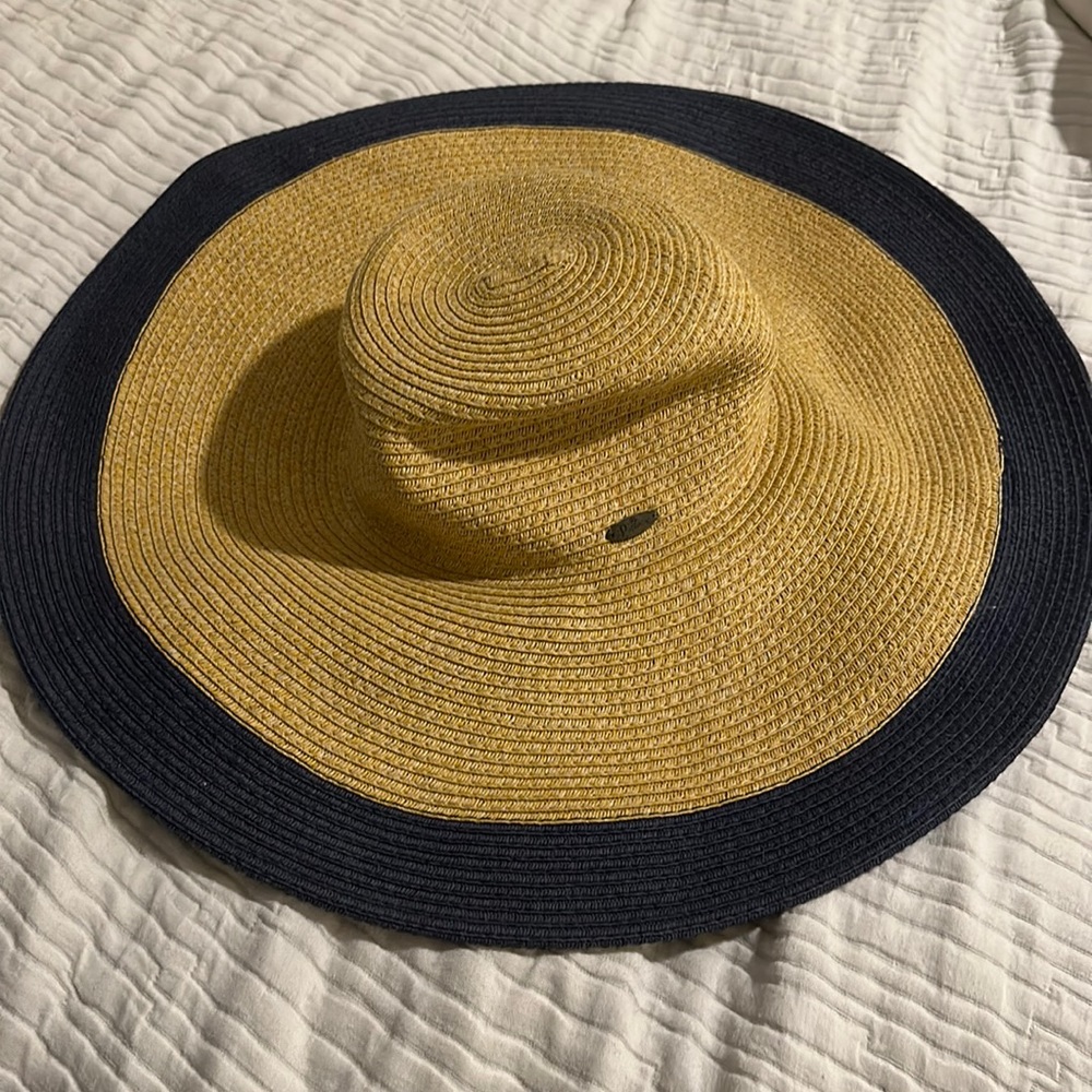 The Papillon Wide rim floppy hat . Navy blue trim sun hat